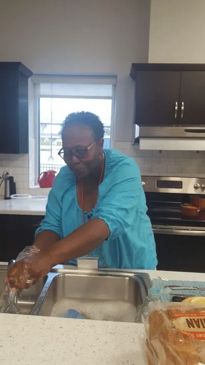 Janie Claytor-Woodson preparing food at a local Ronald McDonald House. 
