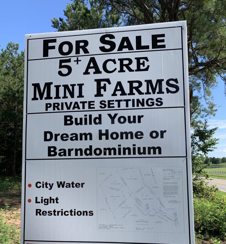 Sign that says, "For Sale 5+ Acre Mini Farms"