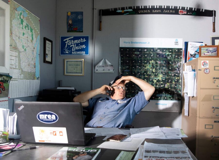 Hans Breitenmoser, a Wisconsin Dairy farmer, sits in his office