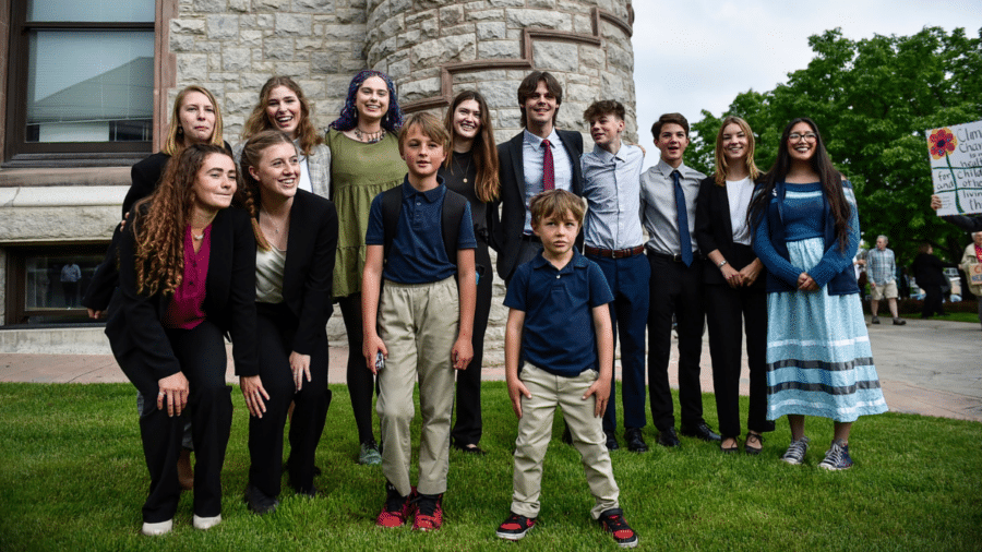 Youth plaintiffs pose for a photo outside the Lewis and Clark County Courthouse.
