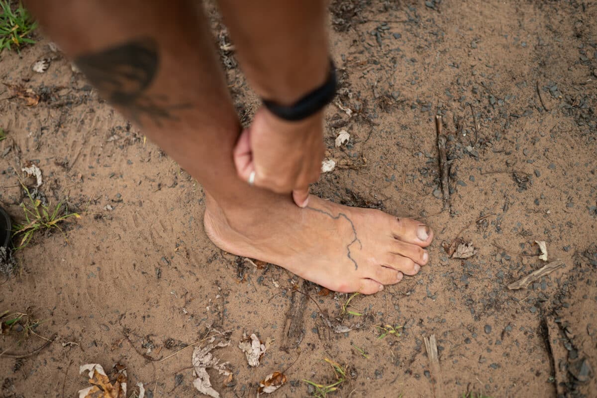 Byron Karns, 63, of Ely, MN, shows off his tattoo of the St. Croix and Namekagon Rivers on his foot on September 11, 2023 in Taylors Falls, MN.